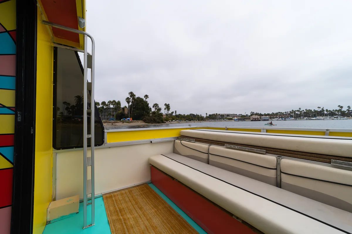 The Disco Boat rooftop deck — open-air lounge above San Diego Bay with the mirrored disco ball